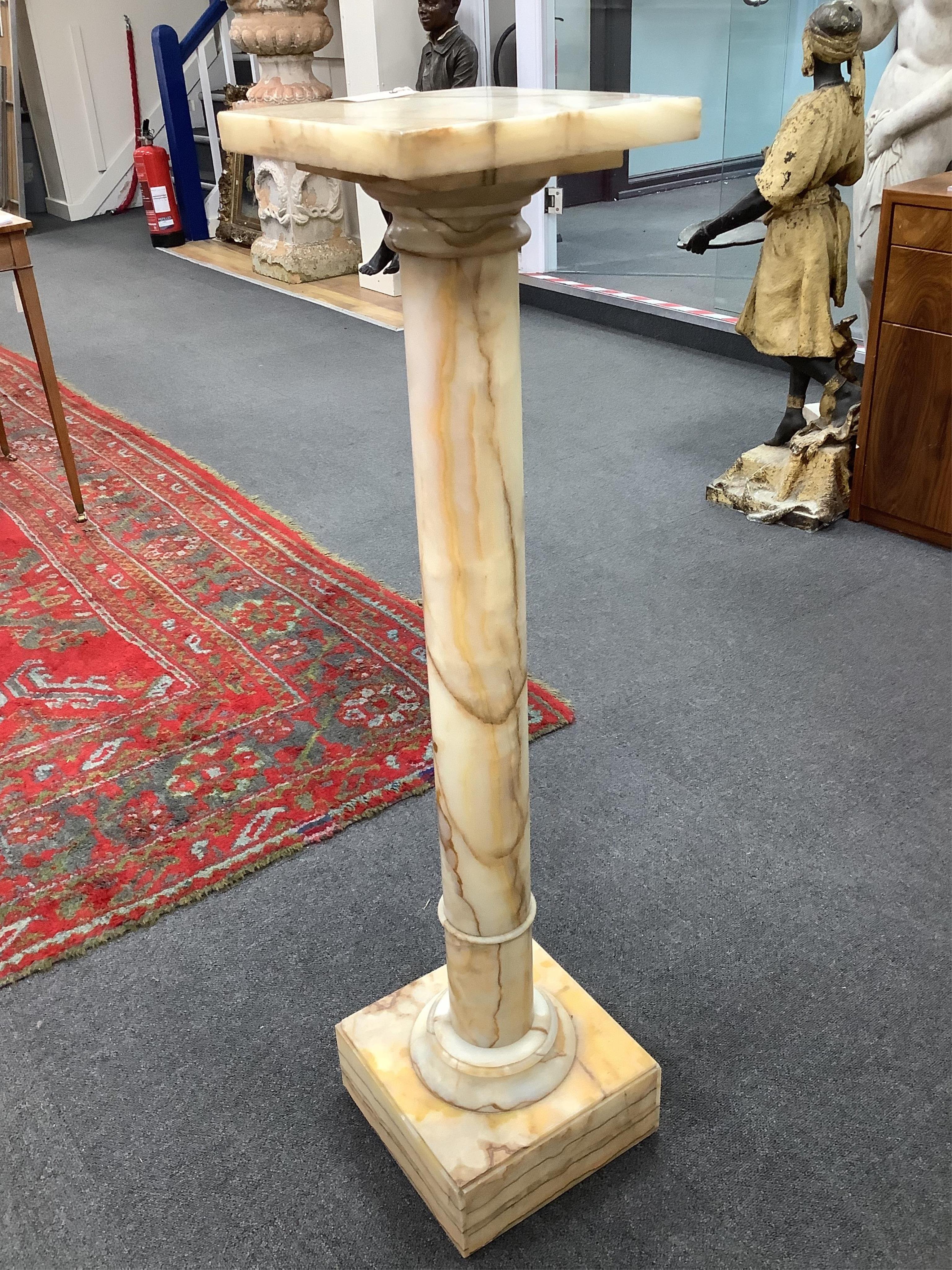 An early 20th century onyx pedestal column, height 106cm. Condition - fair to good, some minor chipping.